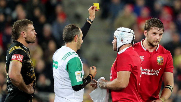 Referee Romain Poite shows Henderson a yellow card