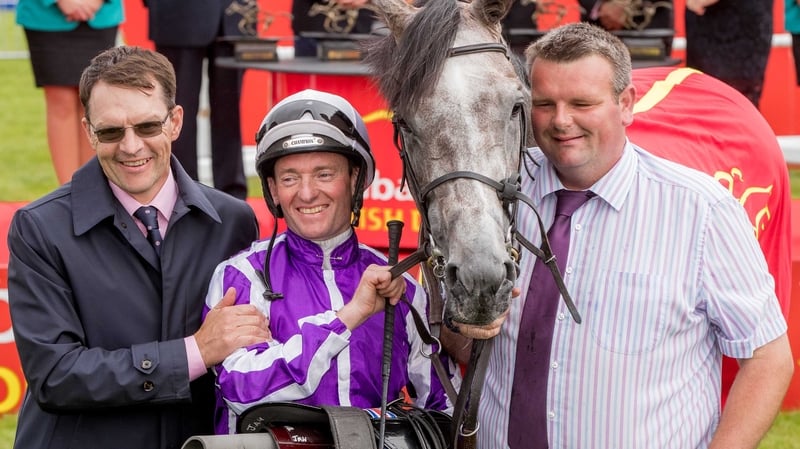 Trainer Aidan O'Brien, jockey Seamie Heffernan and David Hickey celebrate winning The Dubai Duty Free Irish Derby with Capri