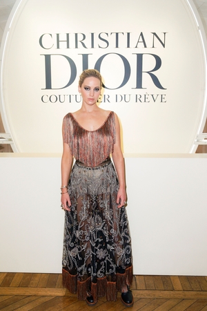 Oscar winning actress and Dior icon Jennifer Lawrence wore a pair of white Dior boxers and 'Wildior' boots under her silk embroidered Dior.