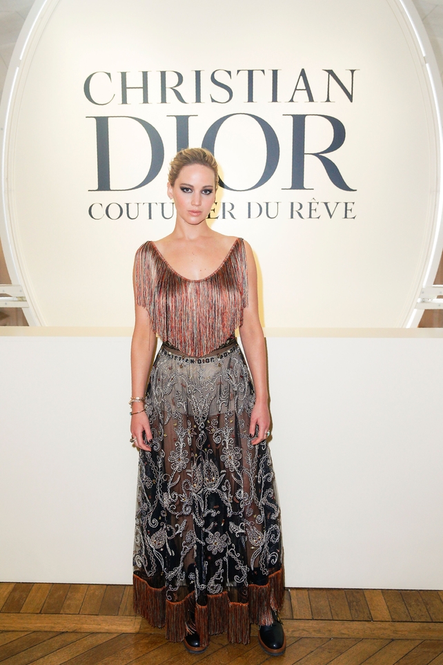 Oscar winning actress and Dior icon Jennifer Lawrence wore a pair of white Dior boxers and 'Wildior' boots under her silk embroidered Dior.