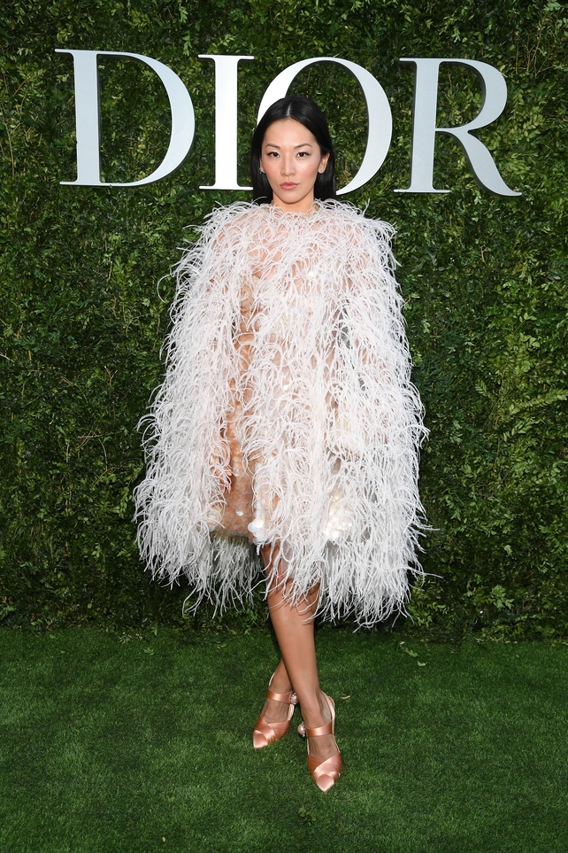 Hong Kong fashion maven Tina Leung looks beautiful in feathers and ballet shoes.