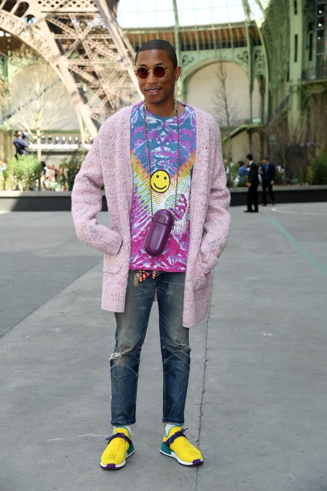 July 4: Funky singer Pharrell Williams looks psychedelic at the Chanel Haute Couture Fashion Show. He's Chanel to his fingertips with his glasses case!