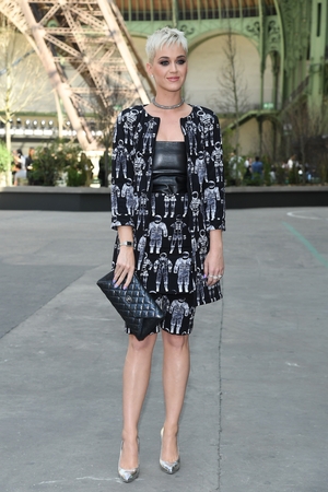 July 4: Cosmic girl! Singer Katy Perry proves that you can be chic and original at the same time in this astronaut ensemble. Wearing a metallic Chanel clutch at the Chanel Haute Couture Fashion Show obviously.