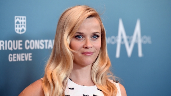 Reese Witherspoon's is off on her holidays but that doesn't mean she's slacking in the style department.