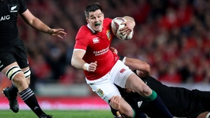 Jonathan Sexton is hauled to the ground