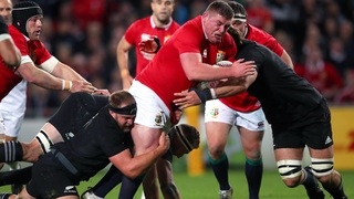Tadhg Furlong is tackled by Sam Whitelock and Joe Moody