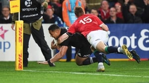 Ngani Laumape scores the first try despite Liam Williams' efforts