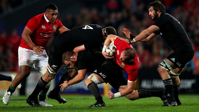 Brodie Retallick, Owen Franks and Samuel Whitelock tackle Alun Wyn Jones