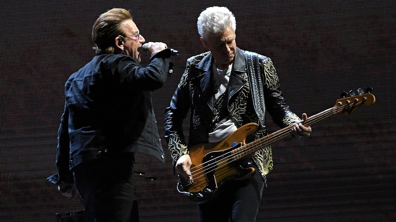 Bono seems to spill the beans on Adam Clayton's baby news on stage in London