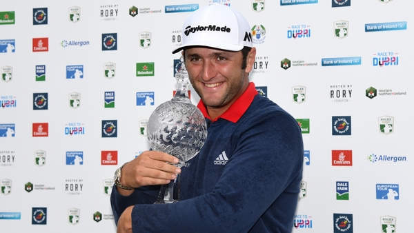 Jon Rahm wraps his arms around the Irish Open trophy