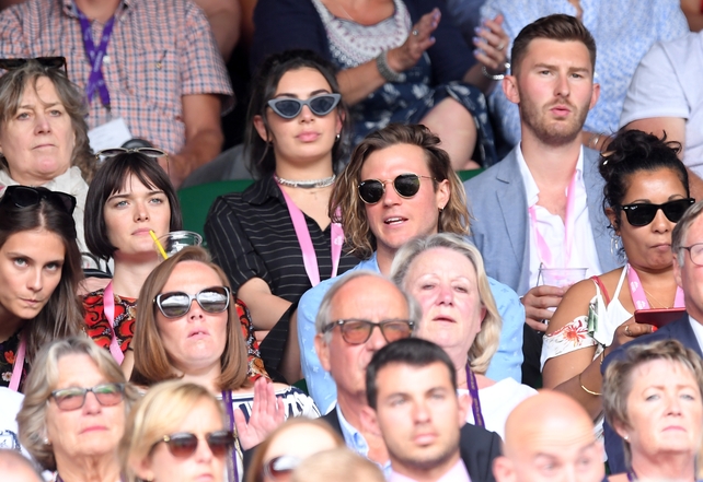 Charli XCX sat behind Sam Rollinson and Dougie Poynter. Charli and Dougie accesorised with some statement sunglasses.