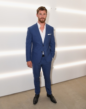 This blue suit matches the actor's eyes and we're melting... Chris Hemsworth was attending the BOSS Menswear show yesterday in New York.