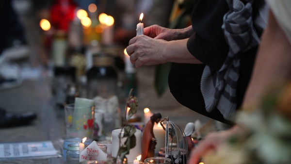 Pictures, flowers and handwritten messages are left in the area