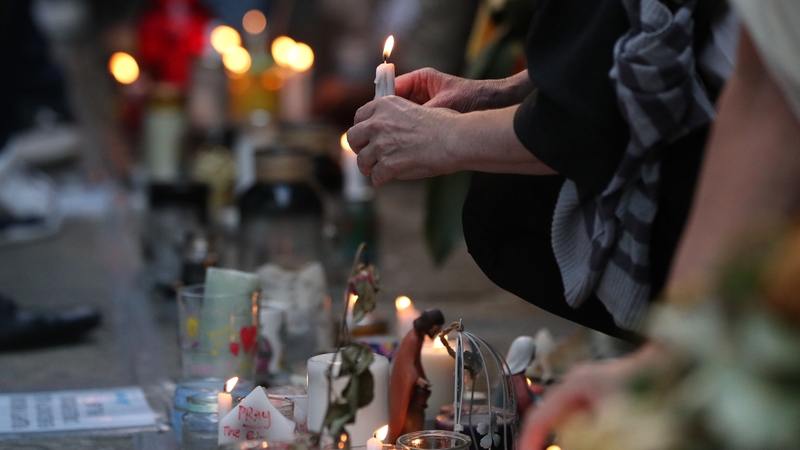 Pictures, flowers and handwritten messages are left in the area