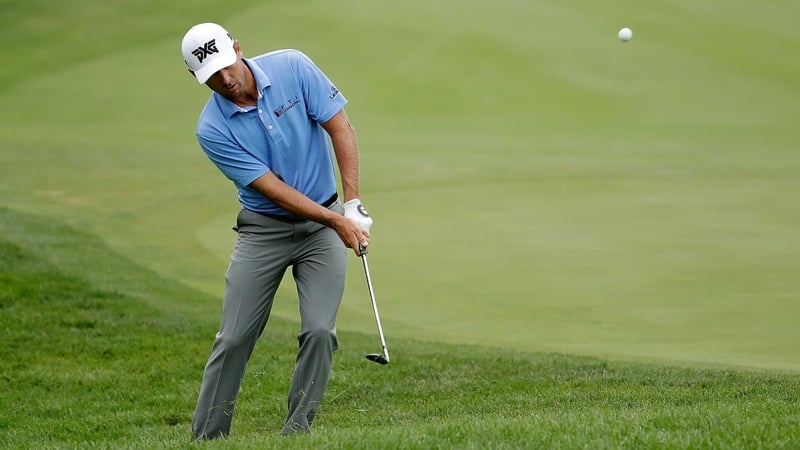 Charles Howell III chips to the green on the 15th hole at TPC Deere Run