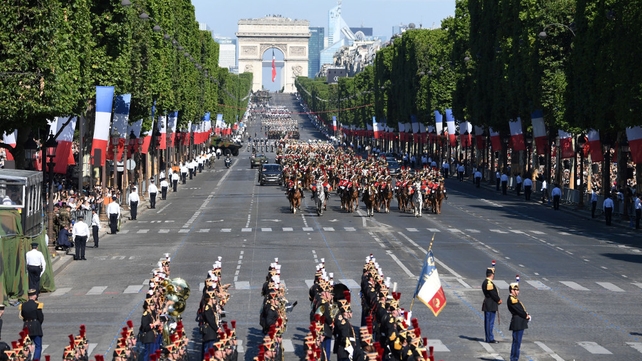 The parade makes its way along the Champs-Elysees
