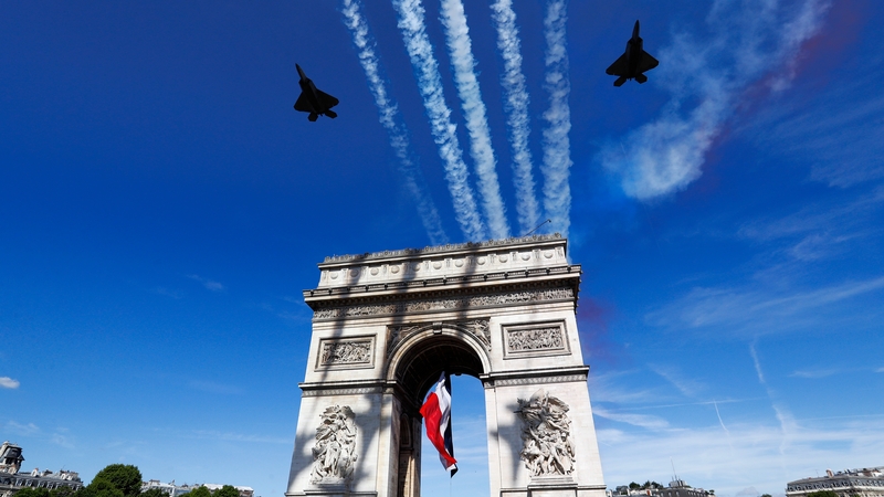 French military aircrafts fly over the Arc de Triomphe during the Bastille Day military parade