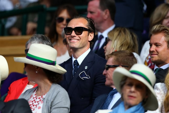 Jude Law looks on from the centre court on day eleven of the Wimbledon Lawn Tennis Championships at the All England. We're loving those sunglasses.