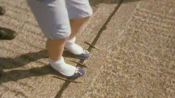 Children playing game of 'Jump Sticks' in Dublin residential street (1982)