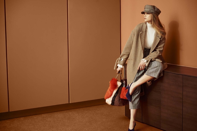 This River Island knee-length beige coat is perfect for pairing with bright accessories.