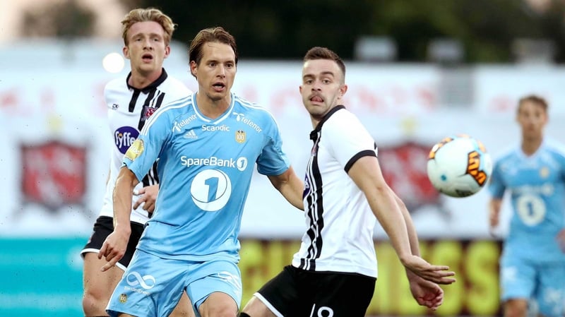 Dundalk's Robbie Benson (R) in action against Anders Konradsen of Rosenborg