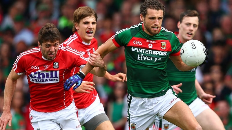 Cork's Tomas Clancy tackles Tom Parsons of Mayo