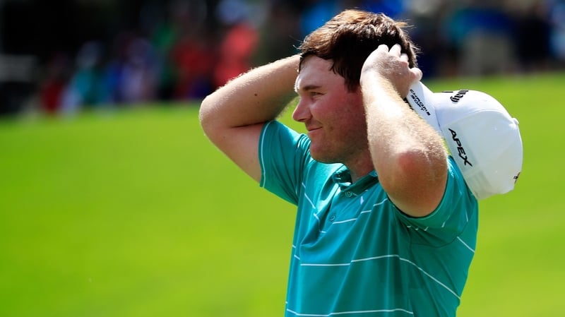 Grayson Murray celebrates winning on the 18th green