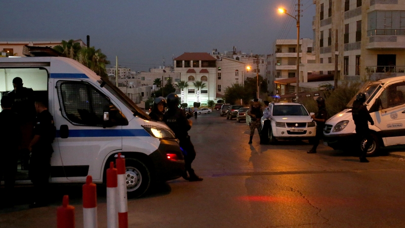Jordanian security forces stand guard outside the Israeli embassy in Amman