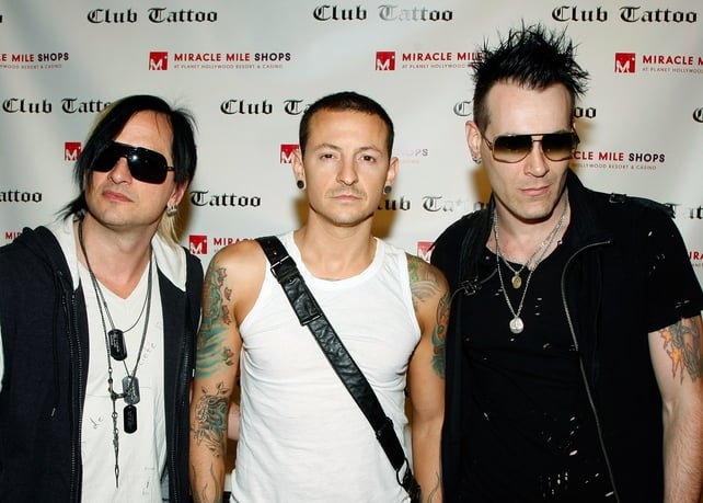 Heavily tattoo'd musicians Amir Derakh, Chester Bennington and Ryan Shuck attend the grand opening of Club Tattoo in 2009