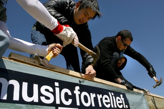 Humanitarian. Joe Hahn and Chester Bennington work together with Music for Relief and Habitat for Humanity while rebuilding homes affected by Hurricane Katrina in New Orleans in 2008