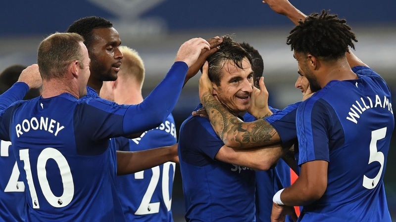 Leighton Baines is congratulated by his team-mates after breaking the deadlock