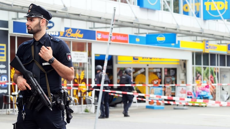 Police stand guard at the scene in Hamburg