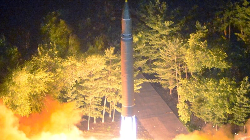 A photo made available by the North Korean Central News Agency (KCNA) shows the second test-fire of the ICBM at an undisclosed location in North Korea yesterday