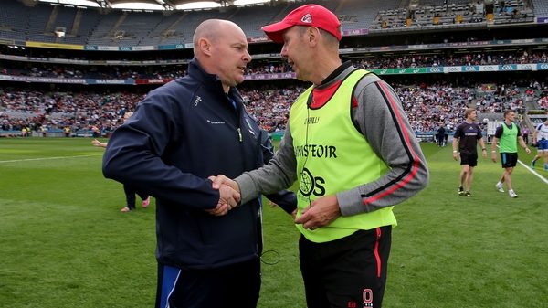 Monaghan manager Malachy O'Rourke (L) and Down boss Eamonn Burns after the game