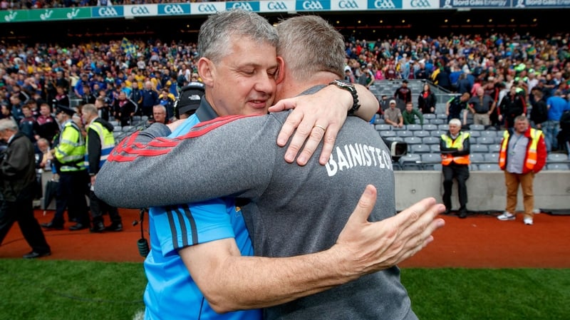 Kevin McStay (L) and Stephen Rochford embrace at the final whistle