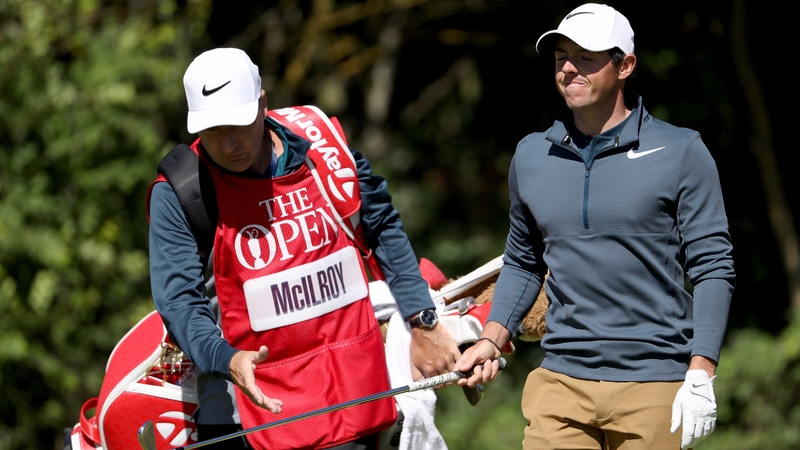 Rory McIlroy grimaces after a poor shot during his opening round at the Open