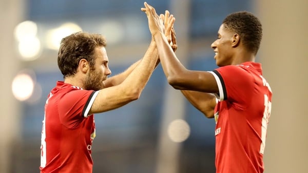 Marcus Rashford congratulates Jaun Mata on his goal at the Aviva Stadium