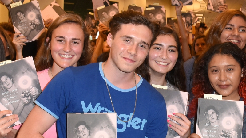Brooklyn Beckham surrounded by fans this week at a signing for his new photography book 'What I See'