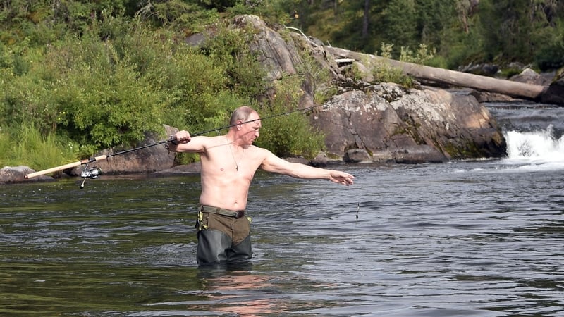 Russian President Vladimir Putin fishing in a mountain lake during his holiday in the Tyva Republic, southern Siberia