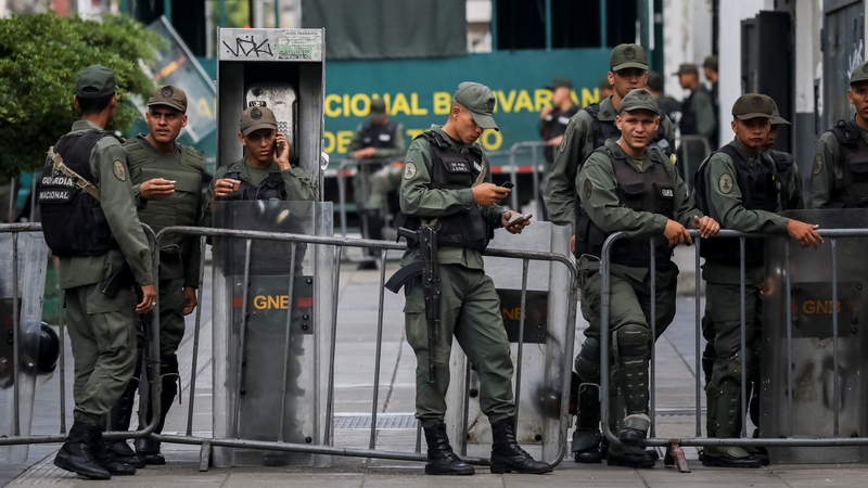 Several members of the Venezuelan National Guard stand guard outside the Attorney General's offices in Caracas, Venezuela