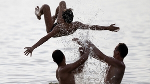 People play in water as they enjoyed the hot weather in a lake in Minsk, Belarus, earlier in the week