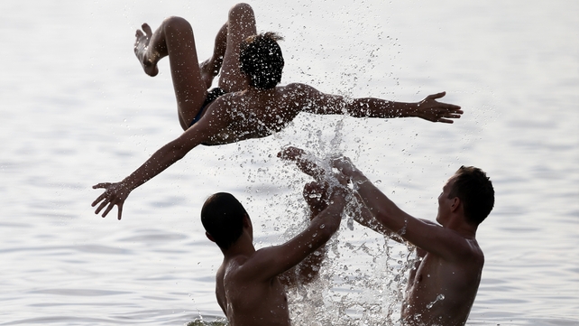 People play in water as they enjoyed the hot weather in a lake in Minsk, Belarus, earlier in the week