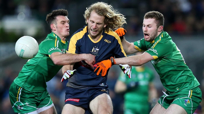 Ireland's Eoin Doyle and Jack McCaffrey with David Mundy of Australia during the 2015 series