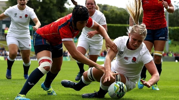 Alex Matthews scores a try despite the efforts of Maria Bravo