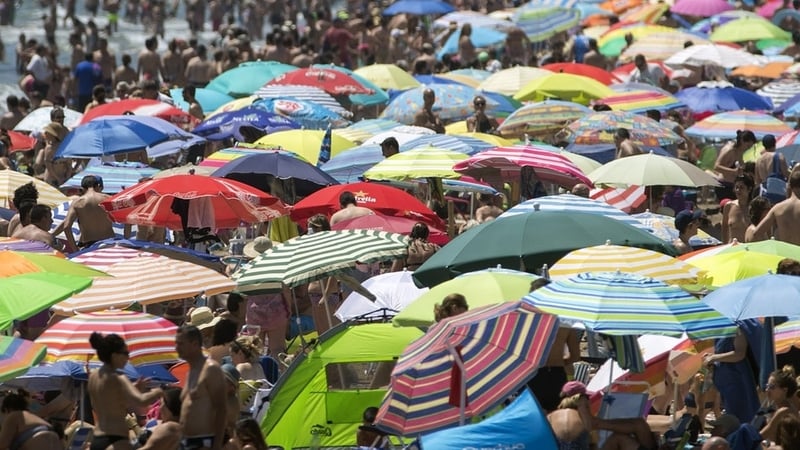 The umbrellas are up all over Spain. Photo: Kai Foersterling/EPA