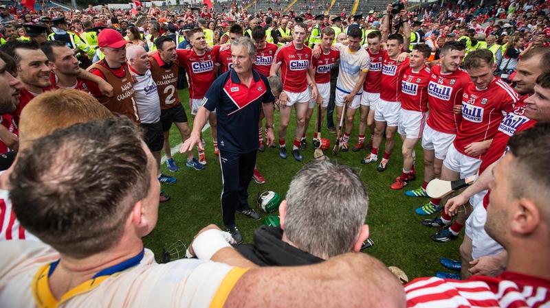 Cork manager Kieran Kingston speaks to his players after winning the Munster title