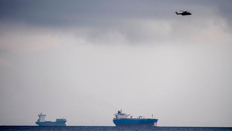 A helicopter flies over the sea off Copenhagen Harbour during the search yesterday
