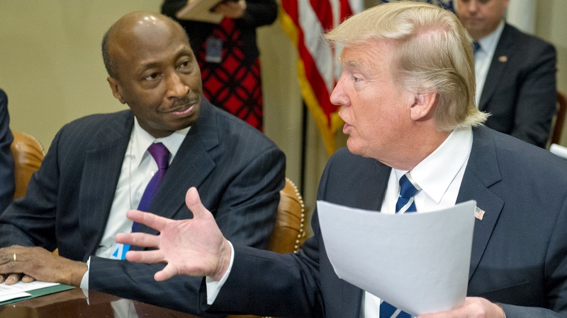 Kenneth Frazier pictured alongside Donald Trump at the White House in January