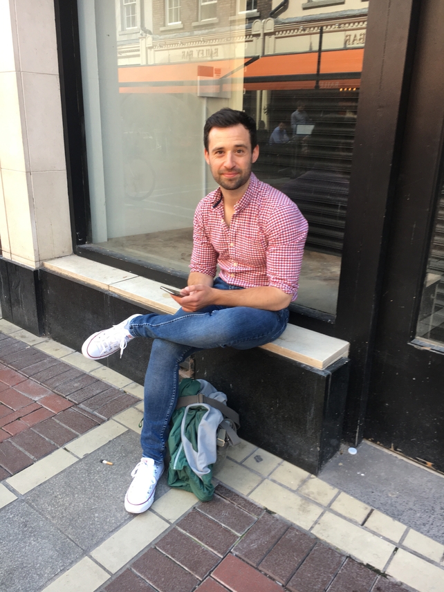 Damien Rogers wears a Pull and Bear shirt with jeans from Zara and white Converse runners.
