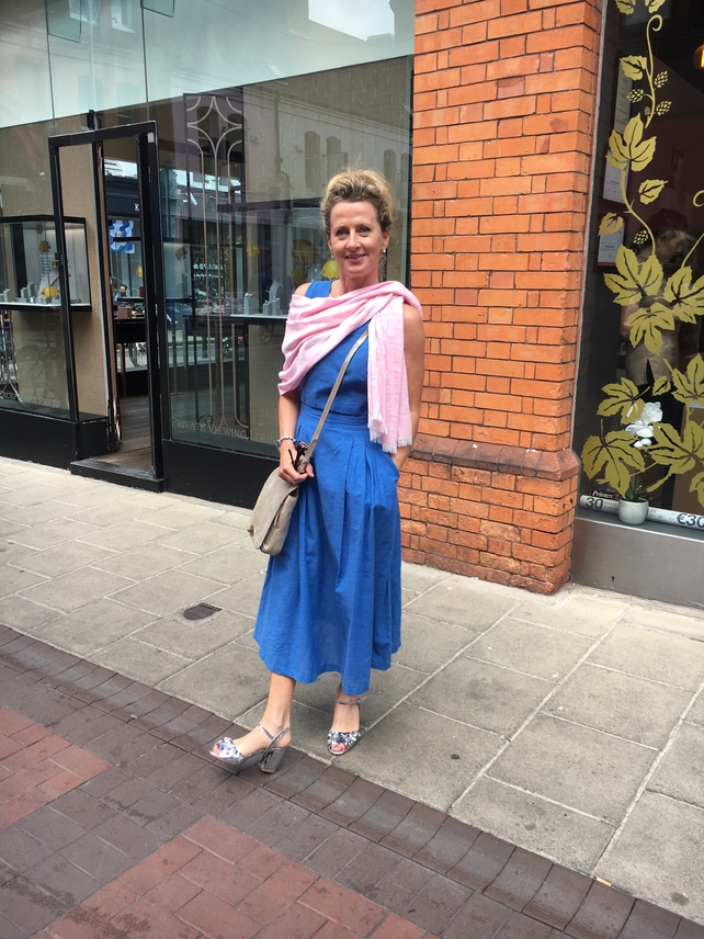 Noreen Collins is wearing a dress from Warehouse which she pairs with a bag from Clarks and sandals from Dunnes Stores. Her scarf was a gift from a friend.